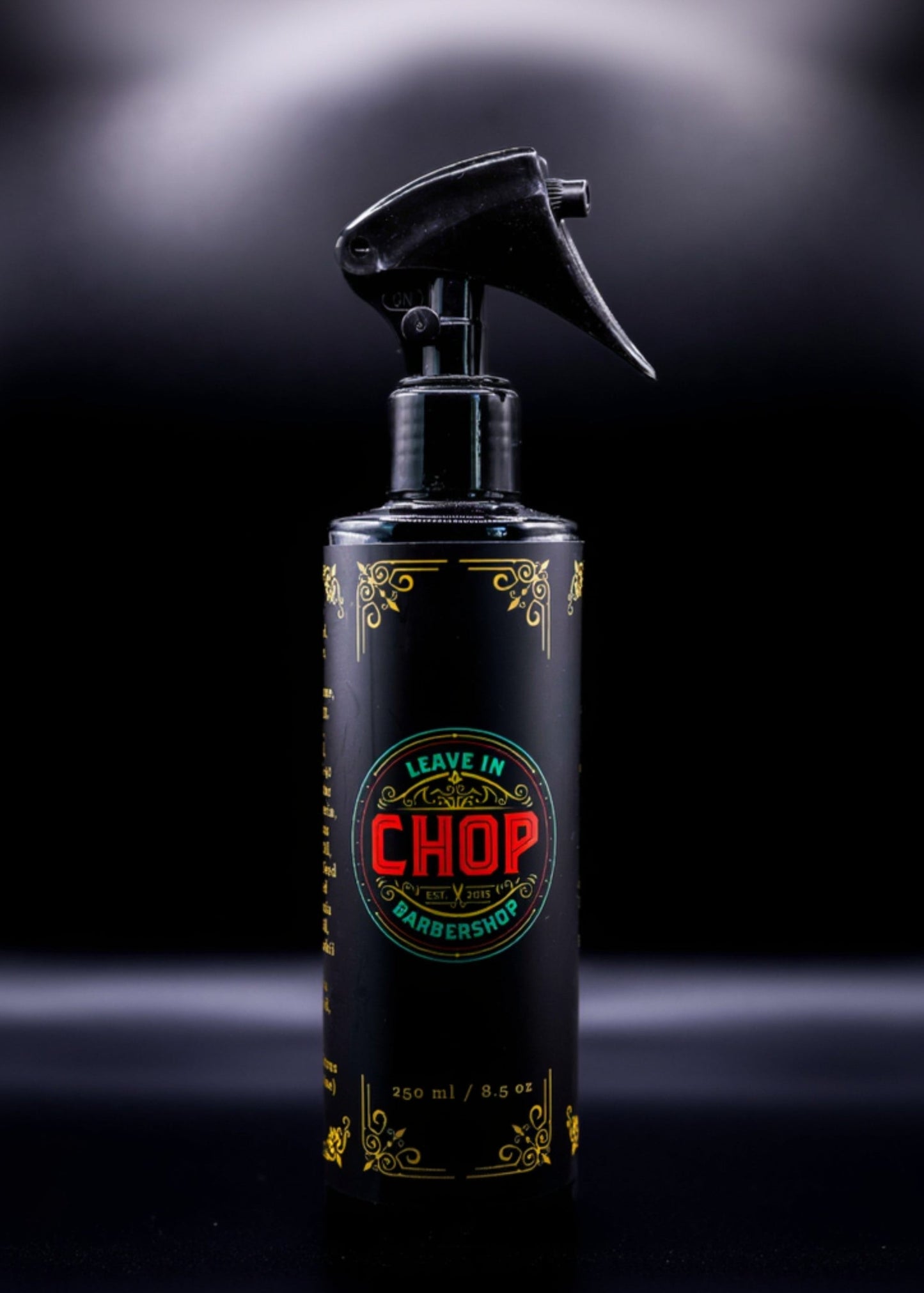 Black bottle of CHOP Leave In Conditioner and Detangler